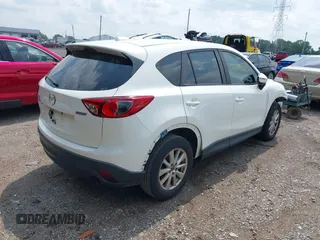 2016 Mazda CX-5 Sport with VIN JM3KE2BY6G0641051, listed as a IAAI auction lot 39959322 with 118,453 mi miles. Bid and sale history available at carsss.com. Image 4.