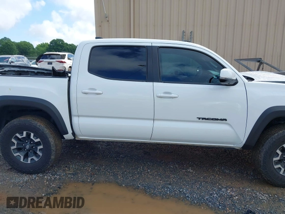 2023 Toyota Tacoma SR with VIN 3TMCZ5AN7PM639378, listed as a IAAI auction lot 42222407 with 38,172 mi miles and . Bid and sale history available at DreamBid. Image 13.