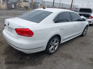 2015 Volkswagen Passat 1.8T SE w/Sunroof & Nav with VIN 1VWBT7A31FC043798, listed as a IAAI auction lot 42108289 with 132,442 mi miles. Bid and sale history available at carsss.com. Image 4.