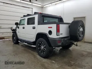 2005 Hummer H2 SUT with VIN 5GRGN22U15H123731, listed as a Copart auction lot 87680395 with 205,043 mi miles and Salvage Title. Bid and sale history available at carsss.com. Image 2.