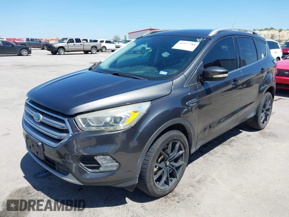 2017 Ford Escape Titanium with VIN 1FMCU0J97HUE07747, listed as a IAAI auction lot 41977788 with 104,560 mi miles. Bid and sale history available at carsss.com. Image 2.