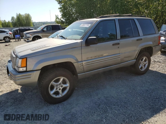 1998 Jeep Grand Cherokee Limited z VIN 1J4GZ88Z1WC231772, wystawiony jako Copart lot #55697775 z przebiegiem 178 896 mil mil oraz Czysty tytuł • Clean title. Historia ofert i sprzedaży dostępna na DreamBid. Obrazek 1.