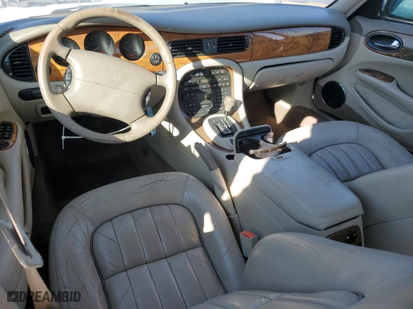 2001 Jaguar XJ with VIN SAJDA14CX1LF29825, listed as a Copart auction lot 42064715 with 127,389 mi miles and Salvage Title. Bid and sale history available at carsss.com. Image 8.
