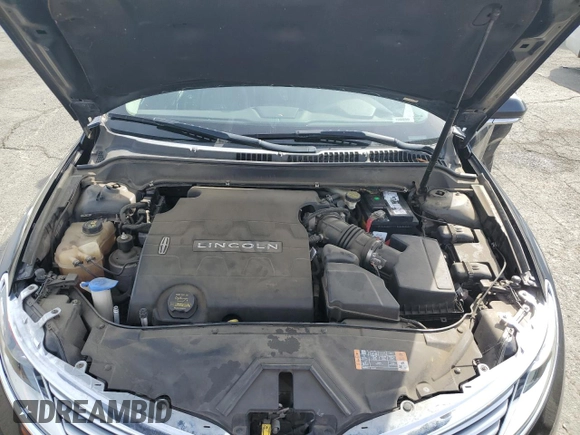 2014 Lincoln MKZ z VIN 3LN6L2GK6ER806741, wystawiony jako Copart lot #57455755 z przebiegiem 96 849 mil mil oraz Szkoda całkowita • Salvage title. Historia ofert i sprzedaży dostępna na DreamBid. Obrazek 11.