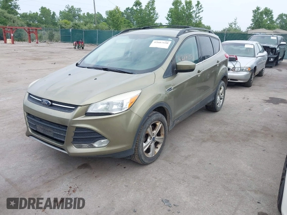 2013 Ford Escape SE with VIN 1FMCU9GX2DUC43098, listed as a IAAI auction lot 42687520 with 104,084 mi miles and . Bid and sale history available at DreamBid. Image 2.
