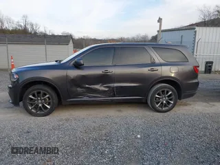 2015 Dodge Durango SXT with VIN 1C4RDJAG4FC784865, listed as a IAAI auction lot 40872452 with 145,877 mi miles and . Bid and sale history available at carsss.com. Image 14.