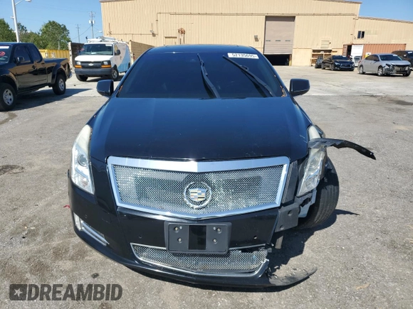 2014 Cadillac XTS Premium z VIN 2G61P5S3XE9238362, wystawiony jako Copart lot #52135695 z przebiegiem 122 428 mil mil oraz Szkoda całkowita • Salvage title. Historia ofert i sprzedaży dostępna na DreamBid. Obrazek 5.
