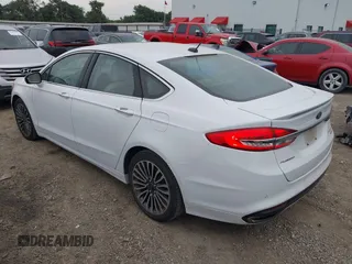 2017 Ford Fusion Titanium z VIN 3FA6P0K96HR124146, wystawiony jako IAAI lot #42428041 z przebiegiem 204 306 mil mil oraz . Historia ofert i sprzedaży dostępna na DreamBid. Obrazek 3.