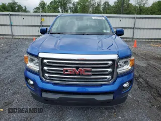 2019 GMC Canyon 4WD SLE z VIN 1GTG6CEN1K1206640, wystawiony jako Copart lot #55339285 z przebiegiem 52 166 mil mil oraz Szkody całkowita. Historia ofert i sprzedaży dostępna na DreamBid. Obrazek 5.