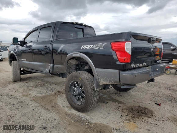 2017 Nissan Titan XD PRO-4X with VIN 1N6BA1F43HN555395, listed as a Copart auction lot 71322364 with 122,826 mi miles and Salvage Title. Bid and sale history available at carsss.com. Image 2.
