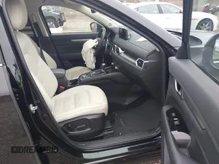 2023 Mazda CX-5 S Carbon Edition z VIN JM3KFBCM9P0130796, wystawiony jako IAAI lot #41956104 z przebiegiem 21 796 mil mil oraz . Historia ofert i sprzedaży dostępna na DreamBid. Obrazek 5.