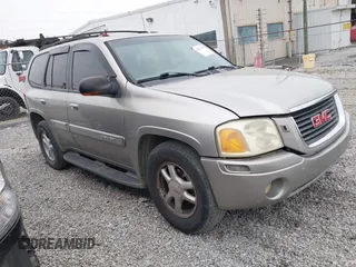 2002 GMC Envoy SLT with VIN 1GKDT13S222241632, listed as a IAAI auction lot 41361598 with 275,343 mi miles. Bid and sale history available at carsss.com. Image 1.