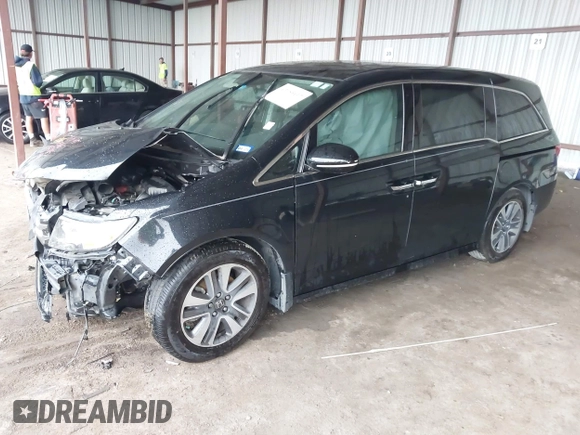 2014 Honda Odyssey Touring with VIN 5FNRL5H98EB095835, listed as a IAAI auction lot 42153412 with 124,131 mi miles and . Bid and sale history available at DreamBid. Image 2.