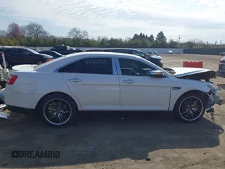 2015 Ford Taurus SEL z VIN 1FAHP2E86FG202386, wystawiony jako IAAI lot #42061925 z przebiegiem 123 475 mil mil oraz . Historia ofert i sprzedaży dostępna na DreamBid. Obrazek 14.
