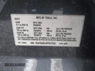 2023 Tesla Model Y Long Range with VIN 7SAYGAEE4PF871281, listed as a IAAI auction lot 41989805 with 15,501 mi miles. Bid and sale history available at carsss.com. Image 9.