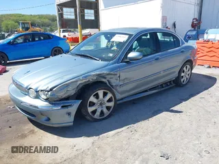 2004 Jaguar X-Type with VIN SAJEA51C64WD99643, listed as a IAAI auction lot 42086360 with 134,126 mi miles and . Bid and sale history available at DreamBid. Image 2.