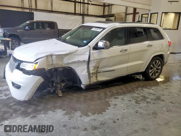 2017 Jeep Grand Cherokee Overland with VIN 1C4RJECG9HC916342, listed as a Copart auction lot 60658285 with 59,470 mi miles and Salvage title. Bid and sale history available at DreamBid. Image 1.