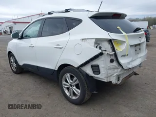 2013 Hyundai Tucson GLS with VIN KM8JU3AC5DU693550, listed as a IAAI auction lot 41919615 with 202,517 mi miles. Bid and sale history available at carsss.com. Image 3.