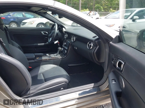 2015 Mercedes-Benz SLK 250 with VIN WDDPK4HA5FF110938, listed as a IAAI auction lot 42098160 with 46,779 mi miles and . Bid and sale history available at DreamBid. Image 5.