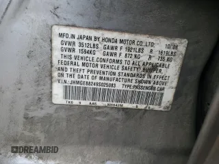 2009 Honda Fit with VIN JHMGE88249S025083, listed as a Copart auction lot 58121945 with Not provided miles and Salvage title. Bid and sale history available at DreamBid. Image 12.