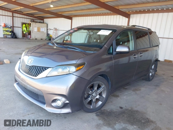 2015 Toyota Sienna SE with VIN 5TDXK3DC1FS667924, listed as a IAAI auction lot 42062805 with 123,504 mi miles. Bid and sale history available at carsss.com. Image 2.