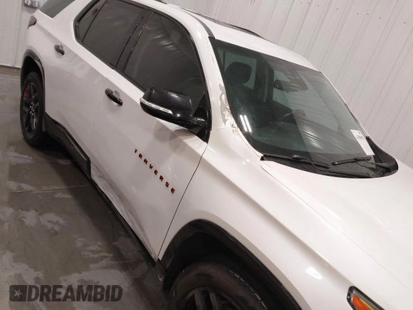 2018 Chevrolet Traverse Premier z VIN 1GNEVJKW4JJ163087, wystawiony jako IAAI lot #41509692 z przebiegiem 118 158 mil mil oraz . Historia ofert i sprzedaży dostępna na DreamBid. Obrazek 6.