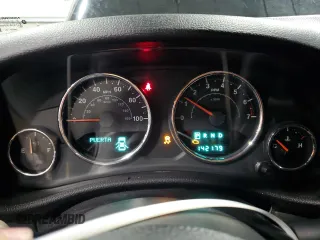 2012 Jeep Wrangler Unlimited Sahara with VIN 1C4BJWEG8CL235893, listed as a Copart auction lot 58195585 with 142,179 mi miles and Salvage title. Bid and sale history available at DreamBid. Image 9.
