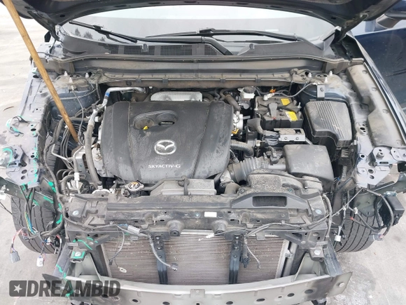 2023 Mazda CX-5 S Premium with VIN JM3KFBDM4P0185865, listed as a IAAI auction lot 42040234 with 32,761 mi miles and . Bid and sale history available at DreamBid. Image 10.