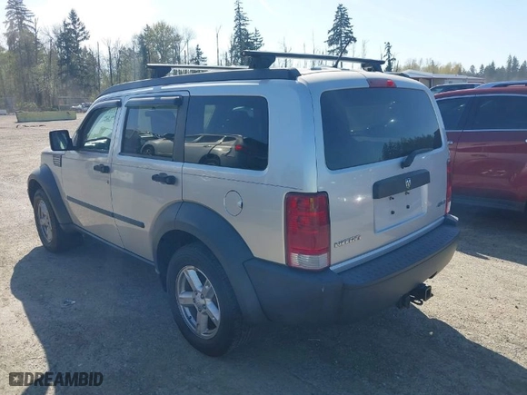 2007 Dodge Nitro SXT with VIN 1D8GU28K87W581969, listed as a IAAI auction lot 42036088 with 128,382 mi miles. Bid and sale history available at carsss.com. Image 3.