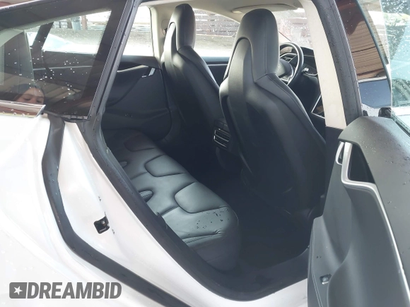 2014 Tesla Model S 60 with VIN 5YJSA1H14EFP63737, listed as a IAAI auction lot 41947610 with 62,240 mi miles and . Bid and sale history available at DreamBid. Image 8.