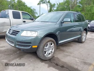 2004 Volkswagen Touareg with VIN WVGCM77L14D045663, listed as a IAAI auction lot 42170895 with 96,709 mi miles and . Bid and sale history available at DreamBid. Image 2.