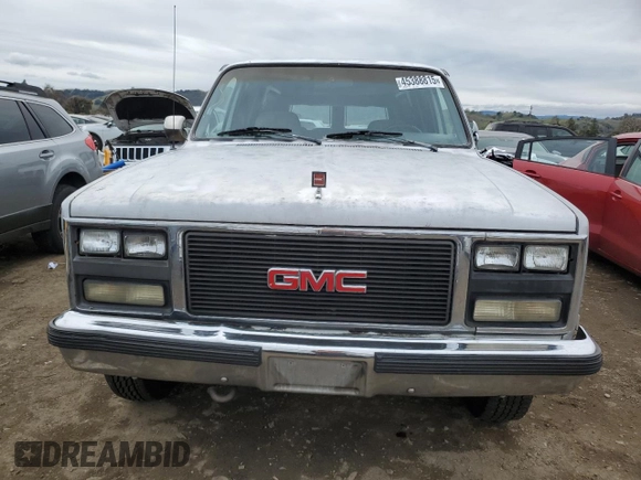 1990 GMC Suburban z VIN 1GKGR26N7LF537148, wystawiony jako Copart lot #45388815 z przebiegiem 265 951 mil mil oraz Czysty tytuł • Clean title. Historia ofert i sprzedaży dostępna na DreamBid. Obrazek 5.