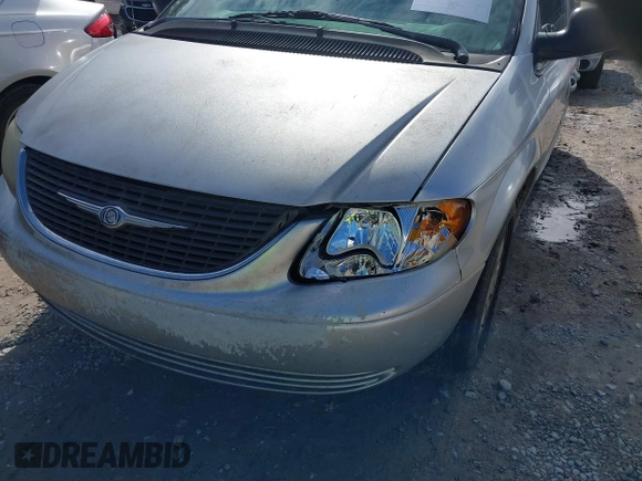 2003 Chrysler Town & Country LX with VIN 2C4GP44L03R203678, listed as a IAAI auction lot 41293296 with 210,827 mi miles and . Bid and sale history available at DreamBid. Image 6.