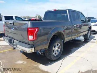 2015 Ford F-150 XLT w/HD Payload Pkg with VIN 1FTFW1EF7FKD04869, listed as a IAAI auction lot 41664736 with 165,784 mi miles. Bid and sale history available at carsss.com. Image 4.