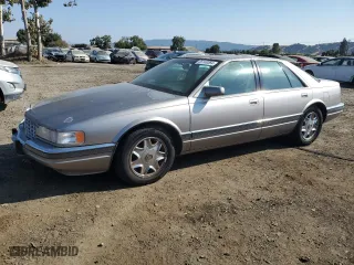 1997 Cadillac Seville Luxury SLS with VIN 1G6KS52Y0VU801906, listed as a Copart auction lot 65169364 with 191,627 mi miles and Salvage Title. Bid and sale history available at carsss.com. Image 1.