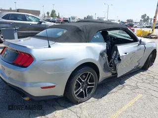 2021 Ford Mustang EcoBoost z VIN 1FATP8UH2M5120162, wystawiony jako IAAI lot #42561125 z przebiegiem 55 360 mil mil oraz . Historia ofert i sprzedaży dostępna na DreamBid. Obrazek 4.