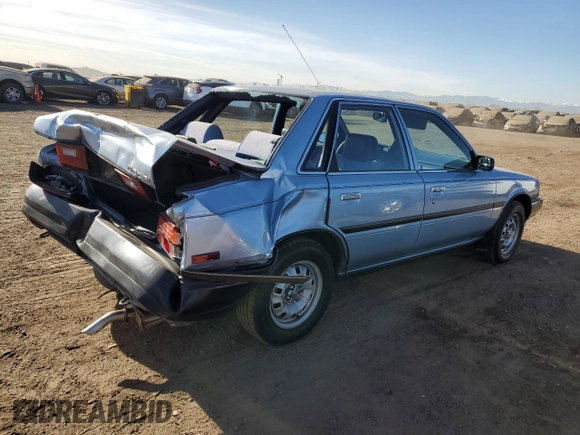 1990 Toyota Camry z VIN 4T1SV24E0LU137556, wystawiony jako Copart lot #84628404 z przebiegiem 247 203 mil mil oraz Czysty tytuł • Clean title. Historia ofert i sprzedaży dostępna na DreamBid. Obrazek 3.