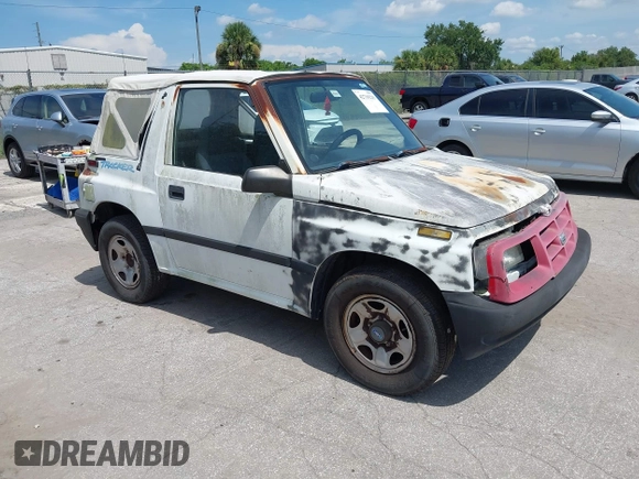 1996 Chevrolet Tracker z VIN 2CNBE1862T6948982, wystawiony jako IAAI lot #42719225 z przebiegiem 257 760 mil mil oraz . Historia ofert i sprzedaży dostępna na DreamBid. Obrazek 1.