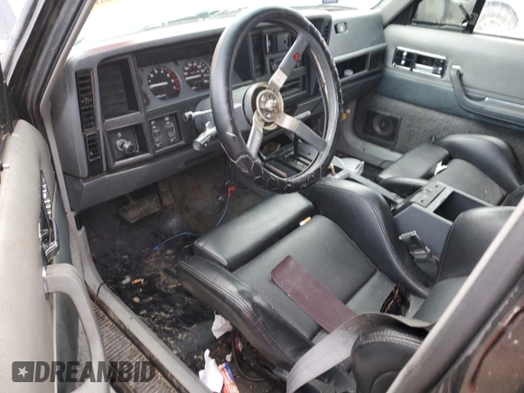 1988 Jeep Grand Cherokee z VIN 1JCMT7895JT247338, wystawiony jako Copart lot #83615234 z przebiegiem 185 676 mil mil oraz Szkoda całkowita • Salvage title. Historia ofert i sprzedaży dostępna na DreamBid. Obrazek 8.