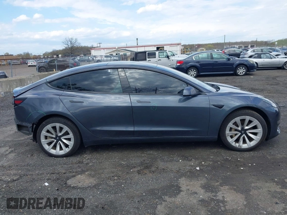 2022 Tesla Model 3 Long Range z VIN 5YJ3E1EB2NF203477, wystawiony jako IAAI lot #42037932 z przebiegiem 56 509 mil mil oraz . Historia ofert i sprzedaży dostępna na DreamBid. Obrazek 13.