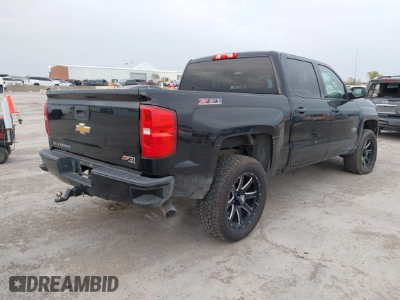 2017 Chevrolet Silverado 1500 LT with VIN 1GCUKREC2HF208232, listed as a IAAI auction lot 40933445 with 105,928 mi miles and . Bid and sale history available at DreamBid. Image 4.