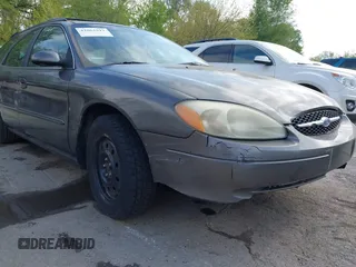 2003 Ford Taurus SE Standard with VIN 1FAFP58U63G117125, listed as a IAAI auction lot 42061812 with 172,154 mi miles. Bid and sale history available at carsss.com. Image 6.