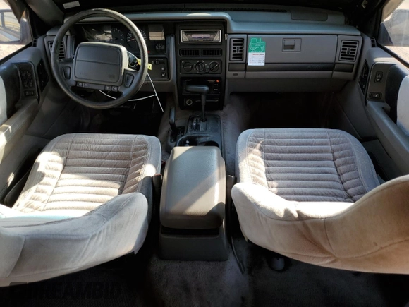 1993 Jeep Grand Cherokee Laredo with VIN 1J4GZ58S8PC656490, listed as a Copart auction lot 49377485 with 236,215 mi miles and Salvage Title. Bid and sale history available at carsss.com. Image 8.