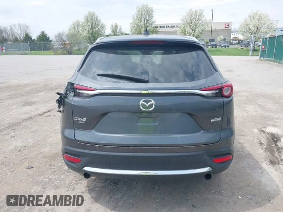 2016 Mazda CX-9 Grand Touring with VIN JM3TCBDY3G0117802, listed as a IAAI auction lot 42150821 with 157,760 mi miles and . Bid and sale history available at DreamBid. Image 16.