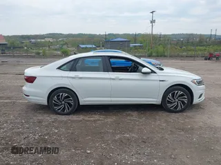 2020 Volkswagen Jetta SEL z VIN 3VWEB7BU3LM073029, wystawiony jako IAAI lot #42168239 z przebiegiem 59 395 mil mil oraz . Historia ofert i sprzedaży dostępna na DreamBid. Obrazek 13.