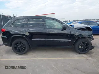 2019 Jeep Grand Cherokee Laredo E with VIN 1C4RJEAGXKC571770, listed as a IAAI auction lot 41677487 with 113,089 mi miles. Bid and sale history available at carsss.com. Image 13.