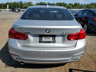 2018 BMW 3 Series with VIN WBA8F1C59JK898499, listed as a Copart auction lot 68247874 with 107,189 mi miles and Salvage title. Bid and sale history available at DreamBid. Image 6.