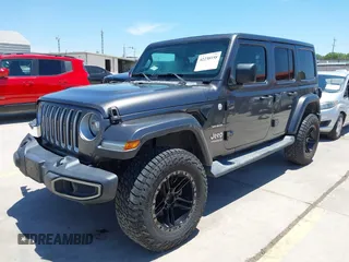 2018 Jeep Wrangler Unlimited Sahara with VIN 1C4HJXEN1JW236779, listed as a IAAI auction lot 42238158 with 72,879 mi miles and . Bid and sale history available at DreamBid. Image 2.