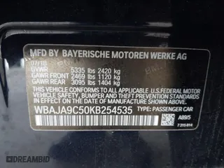 2019 BMW 5 Series 530e iPerformance with VIN WBAJA9C50KB254535, listed as a IAAI auction lot 41094049 with 57,874 mi miles. Bid and sale history available at carsss.com. Image 9.