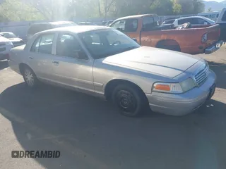 2004 Ford Crown Victoria LX z VIN 2FAFP74W74X132151, wystawiony jako IAAI lot #42169456 z przebiegiem 224 124 mil mil oraz . Historia ofert i sprzedaży dostępna na DreamBid. Obrazek 1.